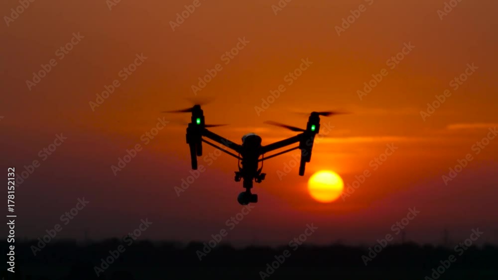 Aircraft flies, in the background a crimson sunset, he flies away Aircraft flies, in the background a crimson sunset, he flies away
