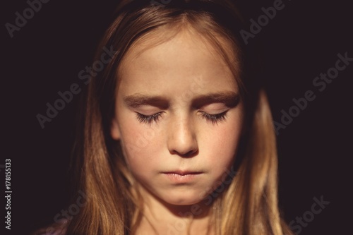 Girl with eyes closed
