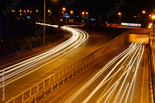 Cars speeding on a highway photo