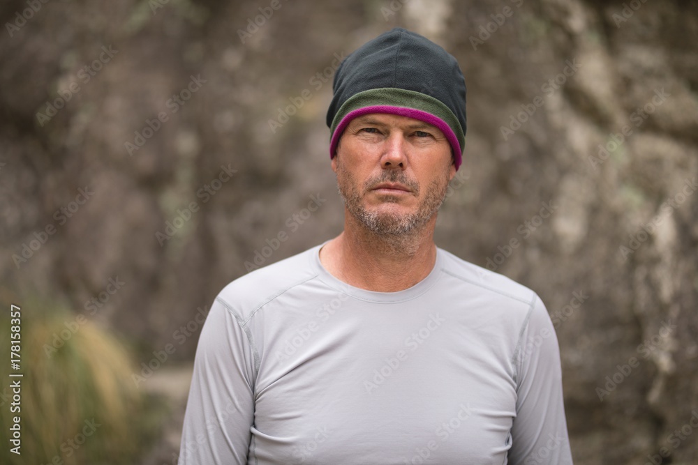Man standing in front of mountain