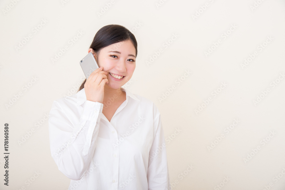 young asian woman using smart phone young asian woman using smart phone