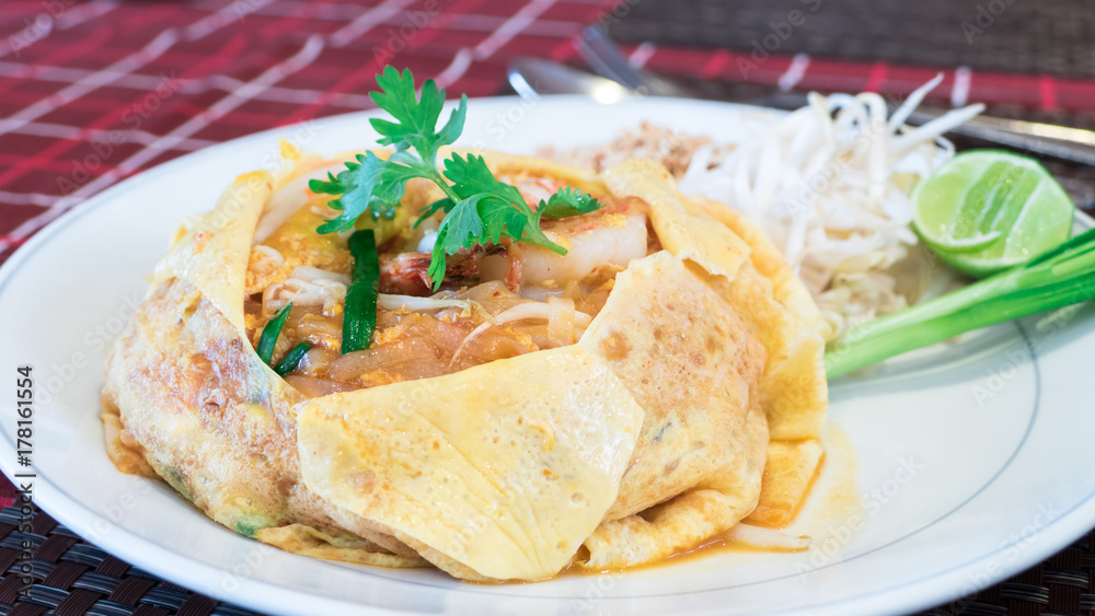 Pad Thai with shrimp and egg on dinner table Pad Thai with shrimp and egg on dinner table