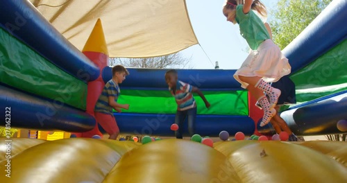 Kids playing on the bouncing castle  photo
