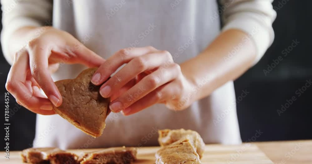 Woman molding gingerbread dough on wooden board Woman molding gingerbread dough on wooden board