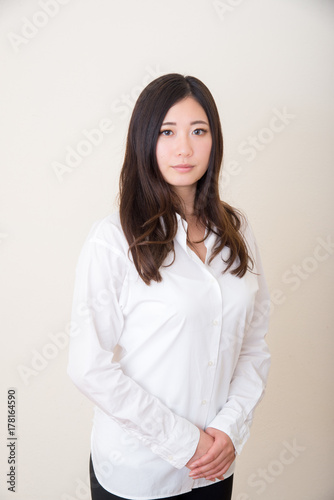 isolated young asian woman with white shirt
