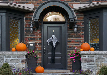 front door of house with Halloween decorations