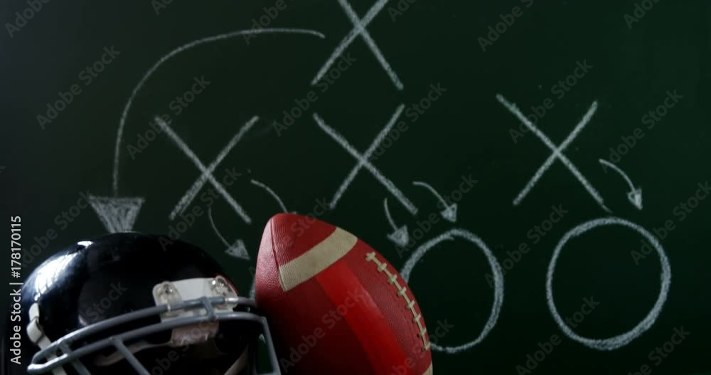 Jersey, head gear and football on artificial turf Jersey, head gear and football on artificial turf