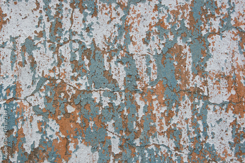 Multicolored peeling wall texture and background. Surface with scratches, stains.