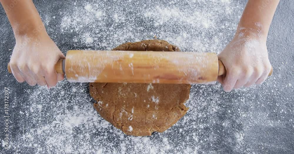 Woman using rolling pin 