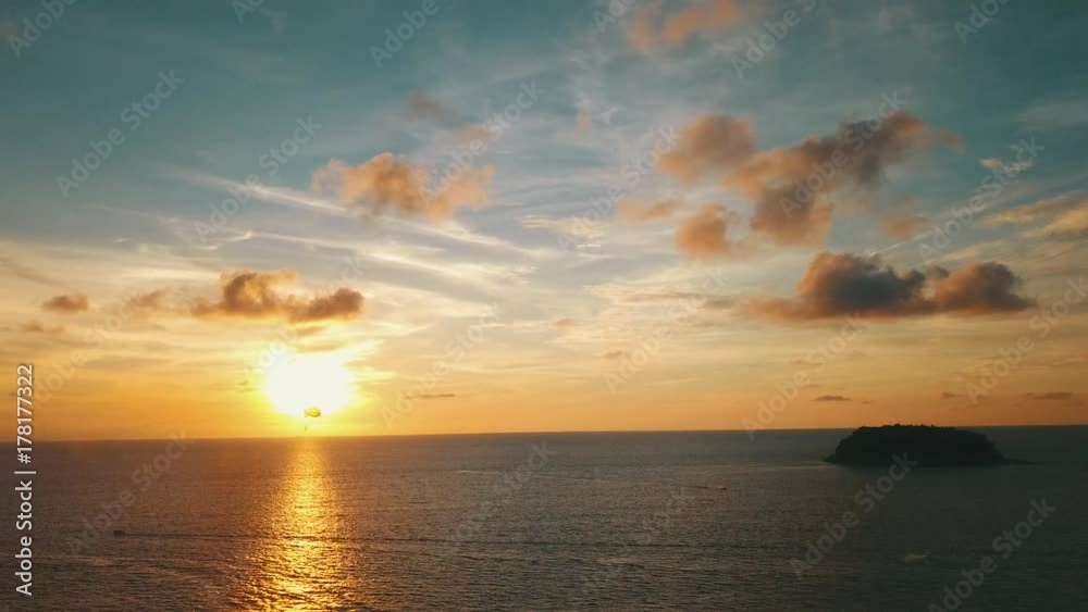 Sunset bay with reflections on water surface