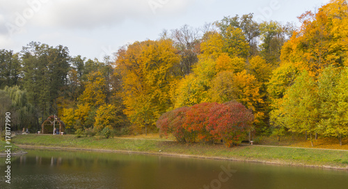 Beautiful autumn landscape with fog over lake