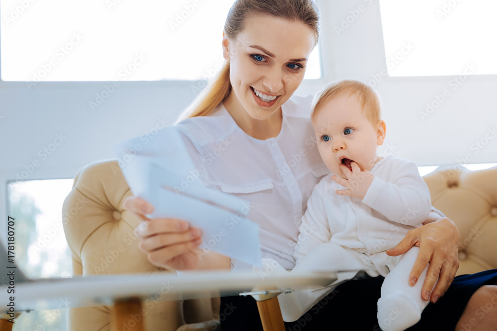 Clever mother developing her child with special cards Clever mother developing her child with special cards