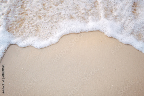 The movement of the waves on the sand is smooth and fine for background,