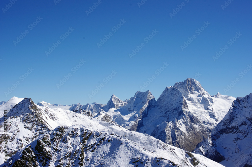 Naklejka premium Mountains landscape and fresh snow in the mountains in autumn