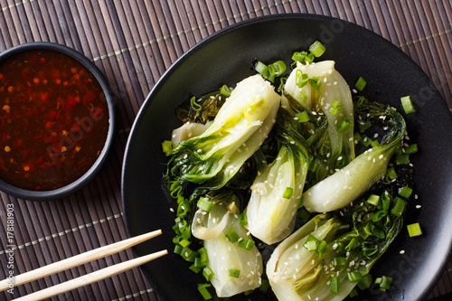 Tableau sur toile stir-fry spicy baby bok choy close-up. horizontal top view