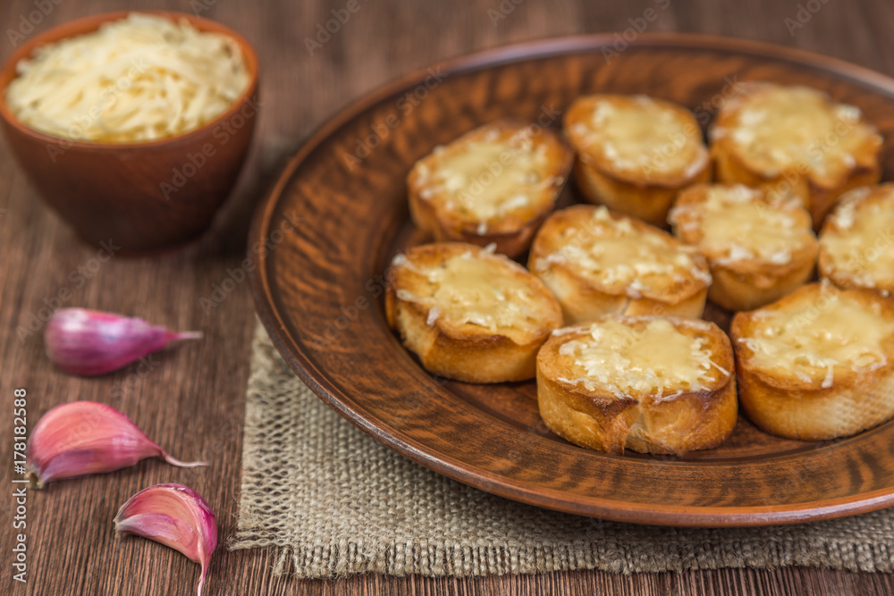 Fried croutons of French baguette with garlic and cheese. Brown. Fried croutons of French baguette with garlic and cheese. Brown.