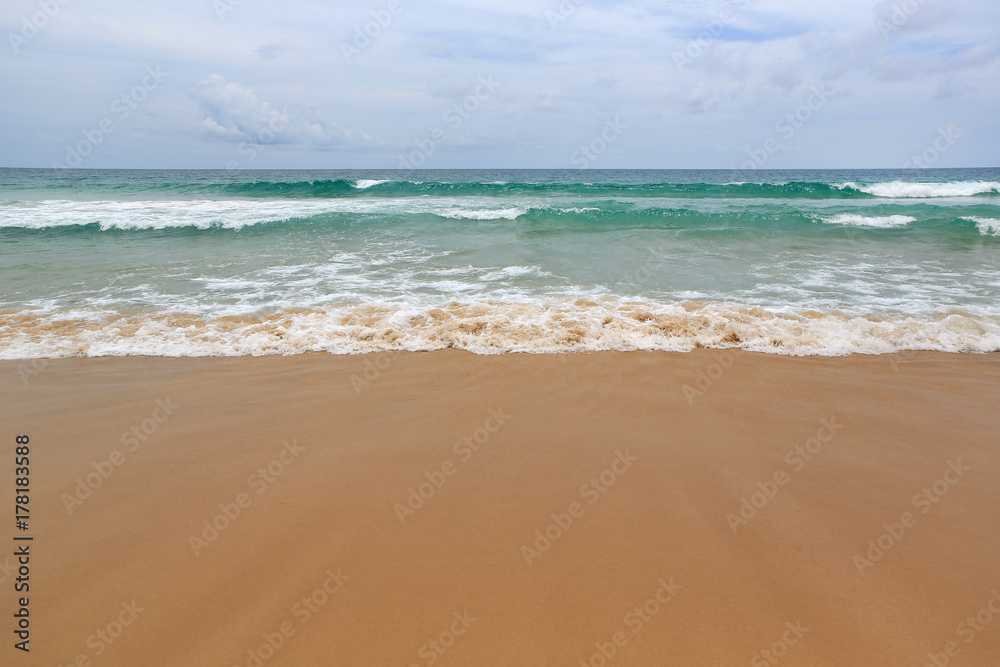 Landscape view of sea wave on the beach sand.