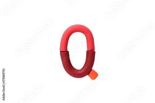 Colorful Alphabet " Q " made from Plasticine (Clay) isolated on white background.