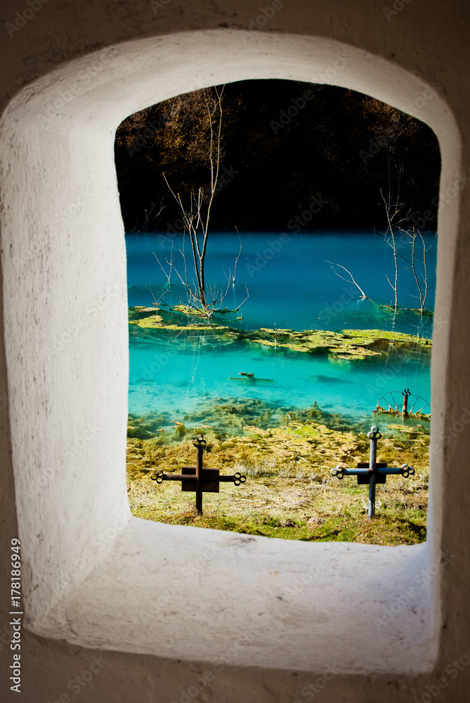 church with its cemetery under contaminated water in Geamana, Romania. Polluted lake with mining residuals that destroyed a village.