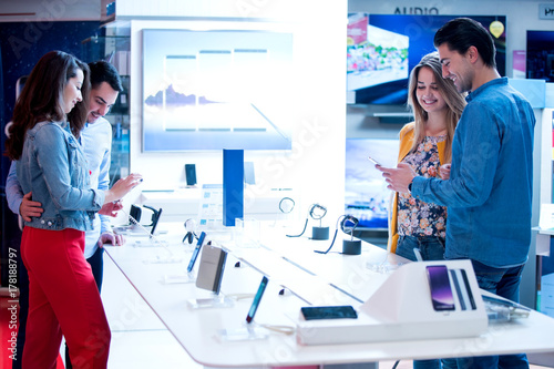 young people shopping for latest phone