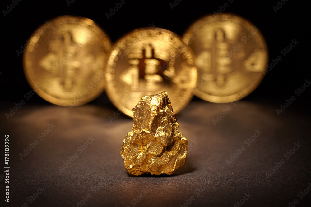 Closeup of big gold nugget and Gold Bitcoins Coins Closeup of big gold nugget and Gold Bitcoins Coins