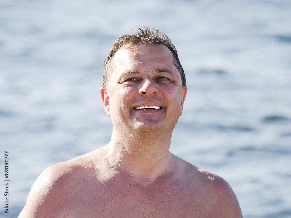 Portrait of a man in the background of the water Portrait of a man in the background of the water