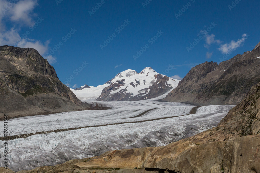glacier Aletsch with blue sky and clouds