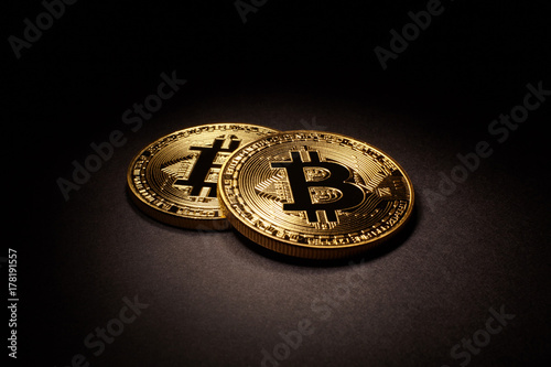 Golden Bitcoins Coins on black background