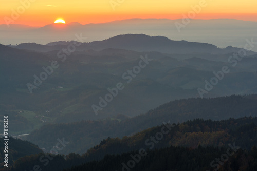 Autumn landscape - Black Forest. Panoramic view over the autumnal Black Forest, the Rhine valley and the Vosges (France) in the distance at sunset. © PhotoGranary