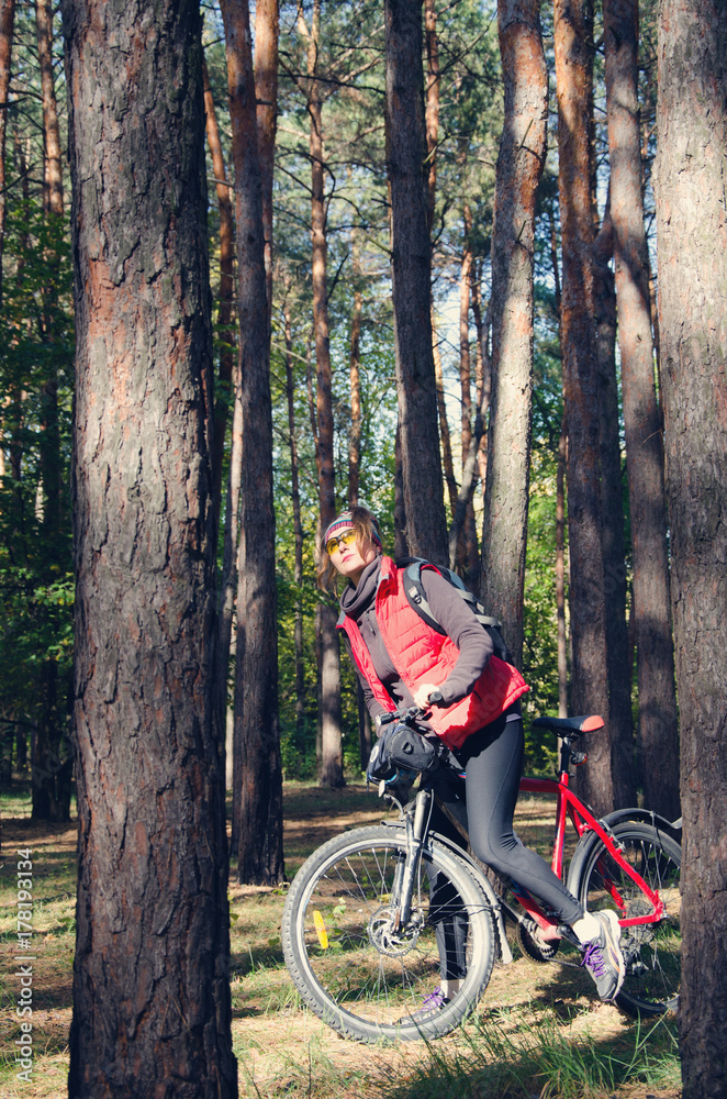 girl with a bicycle among the trees girl with a bicycle among the trees