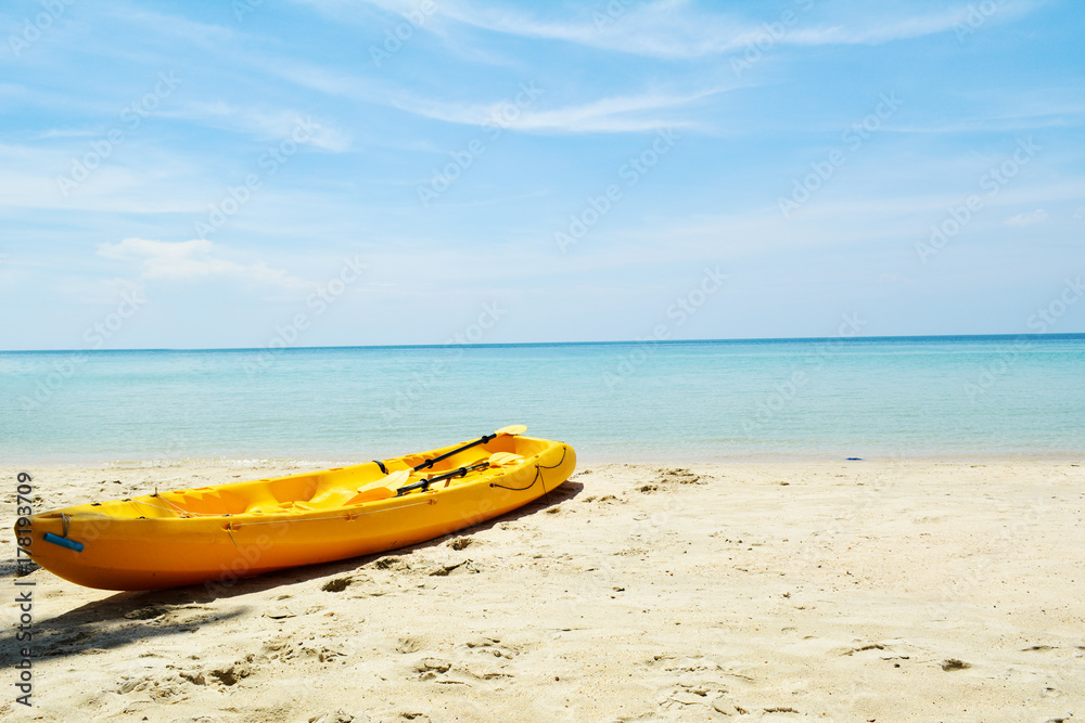 Yellow kayak in the beach on seafront , relax time on vacation Yellow kayak in the beach on seafront , relax time on vacation