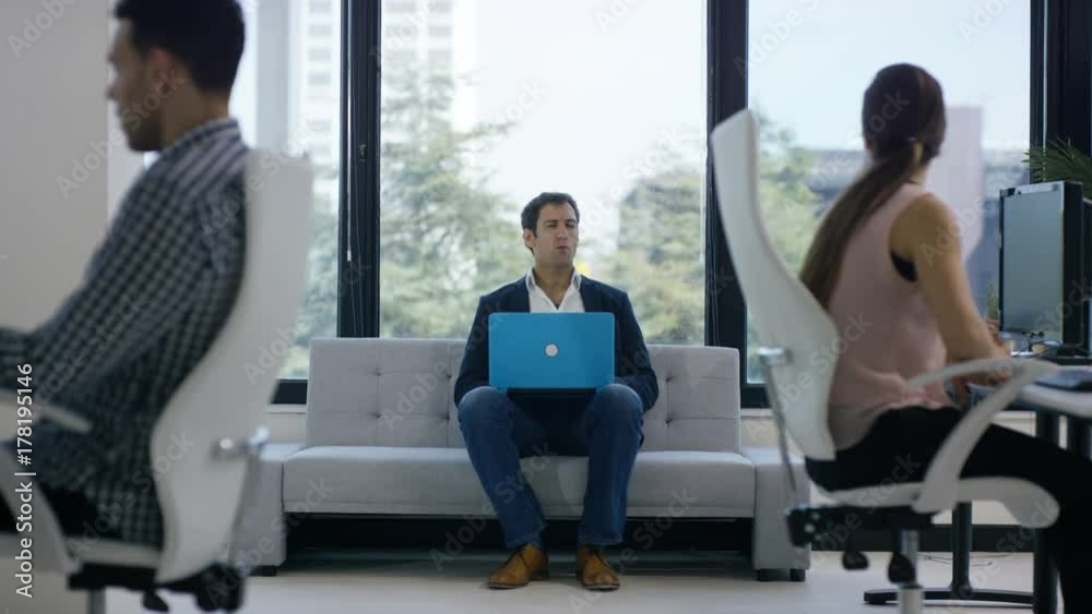 Business team in office meeting, looking at sales figures & discussing ideas Business team in office meeting, looking at sales figures & discussing ideas