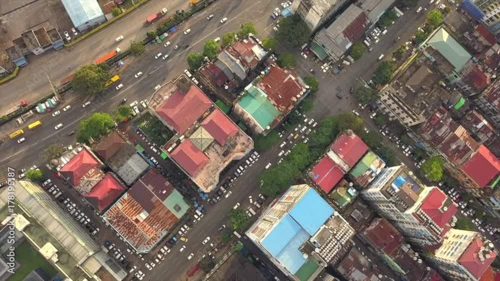 4K Aerial, the camera hangs in place without moving above road junction,streets at China Town and city of Yangon 4K Aerial, the camera hangs in place without moving above road junction,streets at China Town and city of Yangon