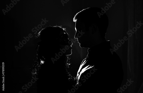 woman  with  theatrical mask and handsome man