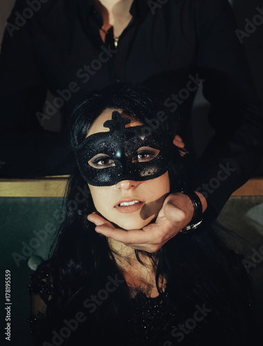 woman  with  theatrical mask and handsome man