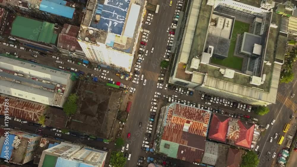 4K Aerial, the camera rises above road junction,streets at China Town and city of Yangon 4K Aerial, the camera rises above road junction,streets at China Town and city of Yangon