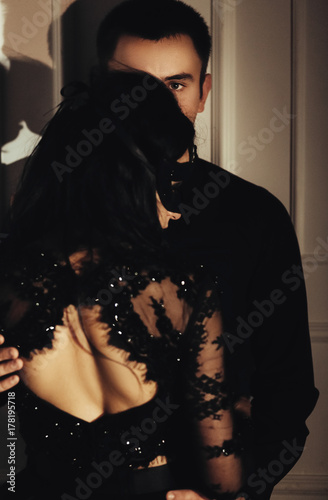 woman  with  theatrical mask and handsome man