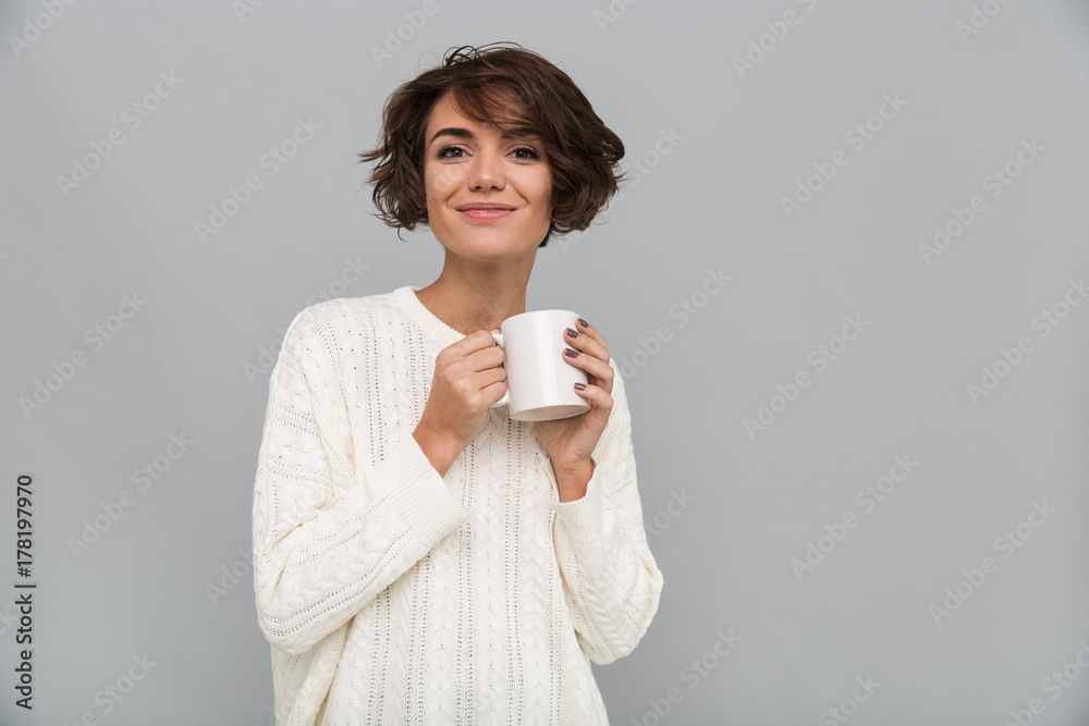 Happy young lady drinking tea. Happy young lady drinking tea.