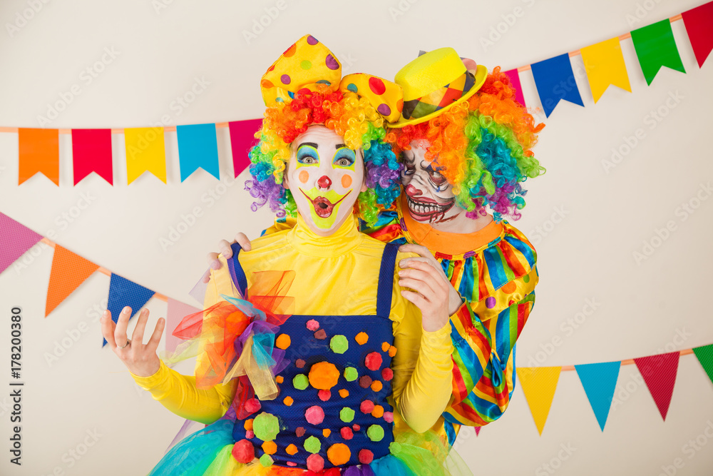 a terrible clown and a good clown. Halloween. The crazy clown and clowness. a terrible clown and a good clown. Halloween. The crazy clown and clowness.