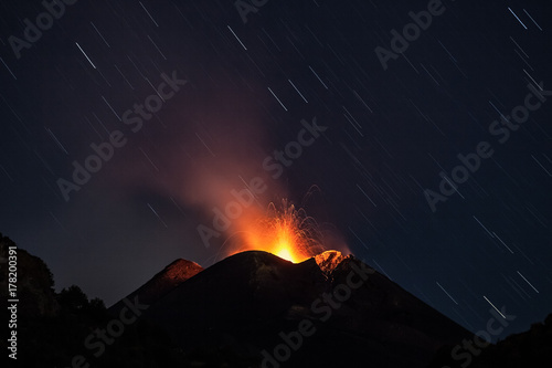 Nighttime at the Etna volcano, a weak strombolian activity , Zafferana, Sicily, Italy