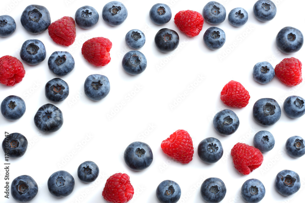 mix of blueberries, raspberries isolated on white background. top view with copy space mix of blueberries, raspberries isolated on white background. top view with copy space