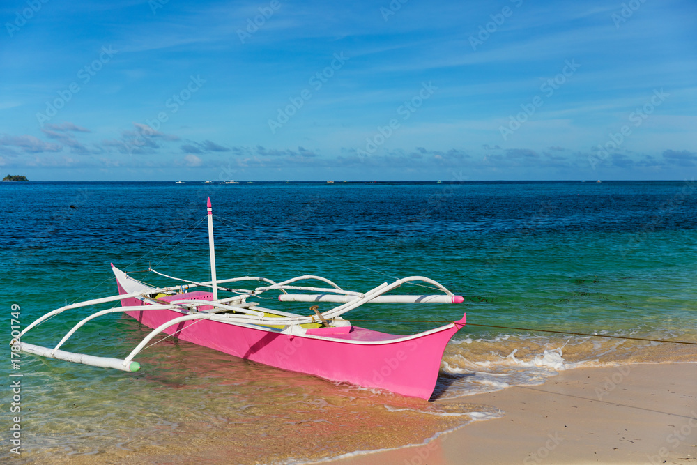 Traditional fishing boat on pristine beach Traditional fishing boat on pristine beach