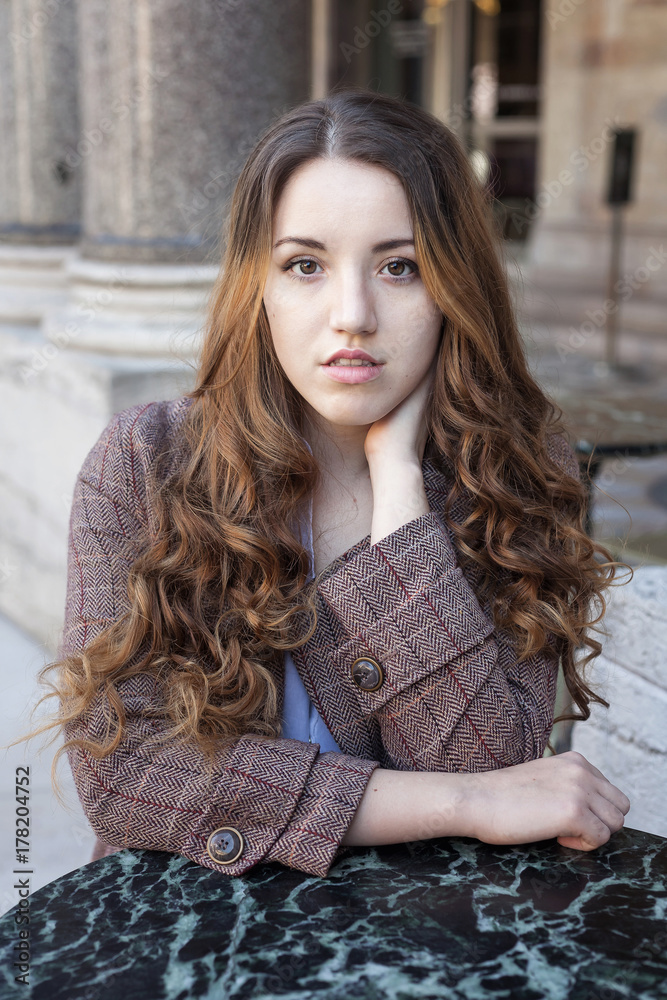 Beautiful young girl with long curly hair