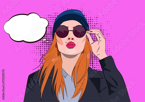 Sexy young woman portrait in sunglasses, leather jacket and hat blowing a kiss