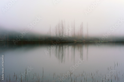 Fog over Lake Arasan. Lake Arasan is located in the territory of the Katon-Karagai district of the East Kazakhstan region of the Republic of Kazakhstan.