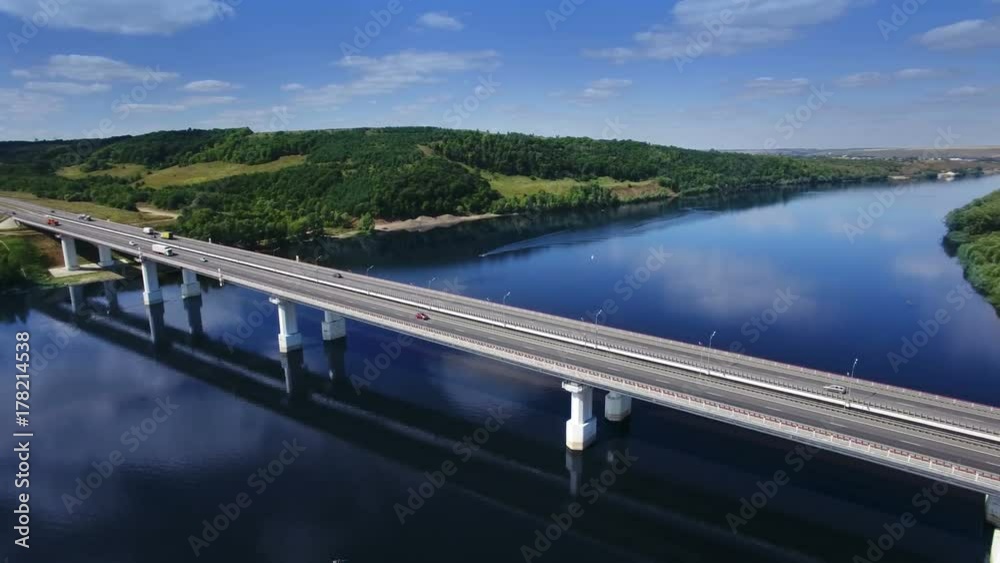 AERIAL Fly over traffic bridge highway roadway road way and blue river with trees forest, Europe, Russia, Tatarstan AERIAL Fly over traffic bridge highway roadway road way and blue river with trees forest, Europe, Russia, Tatarstan