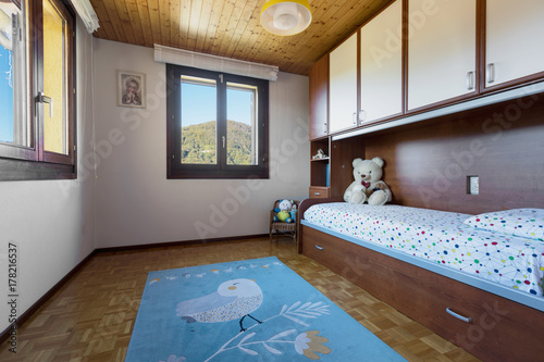 Bedroom with floor and wooden ceiling photo