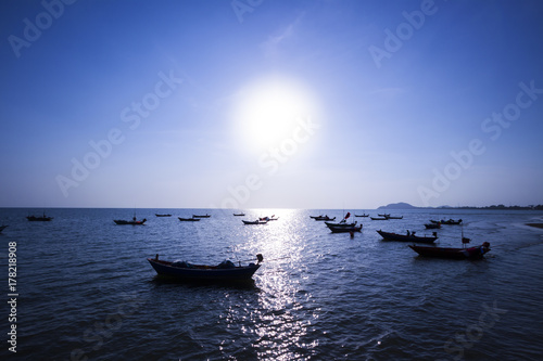 Fototapeta Naklejka Na Ścianę i Meble -  Sea locals fishing boats at sunset