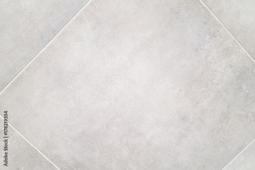 Gray patterns on a tile floor or walkway Gray patterns on a tile floor or walkway