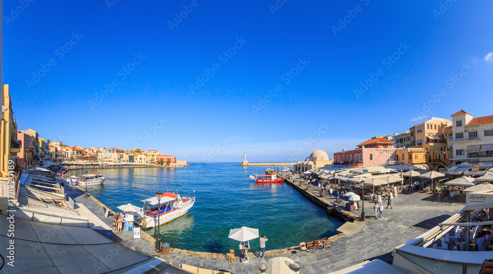 GREECE, CRETE, CHANIA - October 18, 2017: Old city, Venetian harbor, view of the embankment, pier and Egyptian lighthouse, editorial.